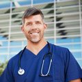 demo-attachment-57-smiling-male-healthcare-worker-outside-hospital-resized